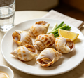 Fresh sea snails on a plate